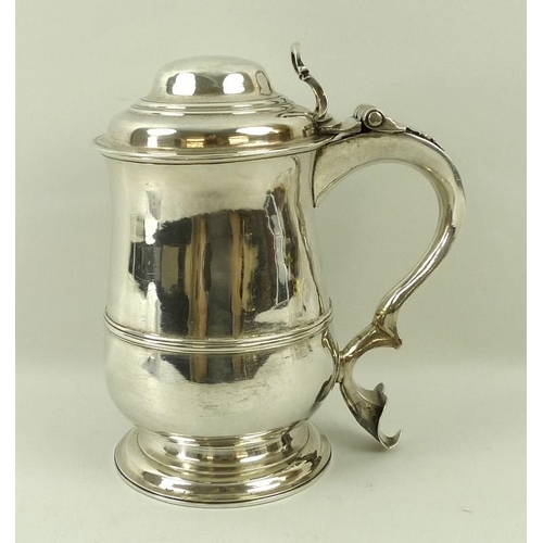 760 - A George III silver lidded tankard, of baluster shape with moulded girdle, the domed lid with pierce... 