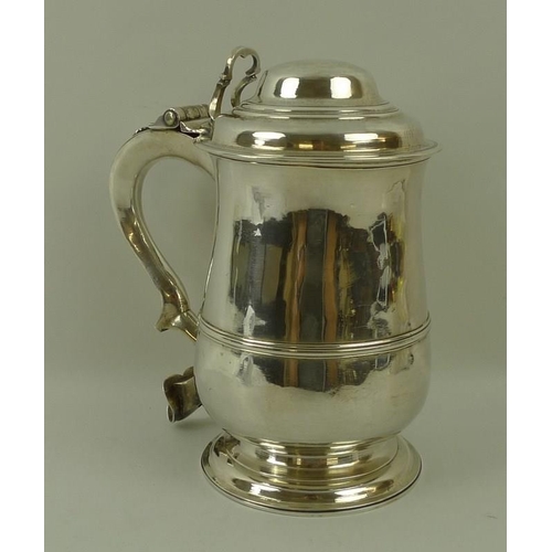 760 - A George III silver lidded tankard, of baluster shape with moulded girdle, the domed lid with pierce... 