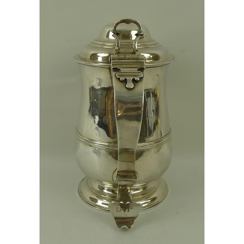 760 - A George III silver lidded tankard, of baluster shape with moulded girdle, the domed lid with pierce... 