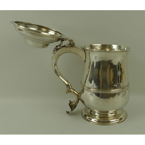 760 - A George III silver lidded tankard, of baluster shape with moulded girdle, the domed lid with pierce... 