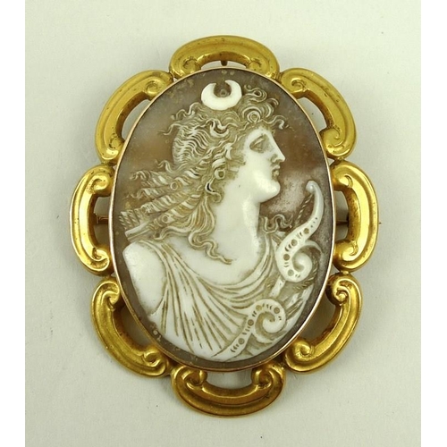 819 - A cameo brooch depicting Diana the huntress, 19th century, in 14ct gold mount with C scrolls, 6.5 by... 