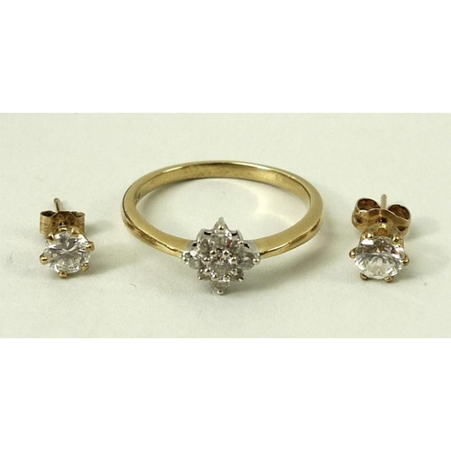 821A - An 18ct gold and diamond ring, nine stones set in a diamond flower head pattern, approximately 0.3ct... 