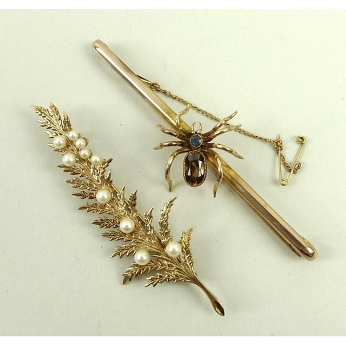 823 - A spider bar brooch with a topaz and sapphire body, and a fern leaf brooch set with seed pearls. (2)