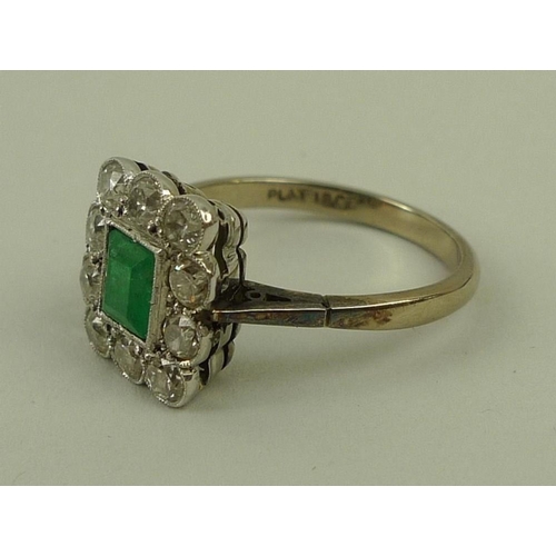 824 - An 18ct white gold, emerald and diamond ring, circa 1900, the central square cut emerald surrounded ... 