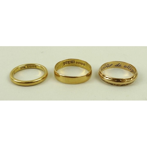 831 - A group of three 22ct gold rings, once engraved sizes J, N and O, 9.3g.