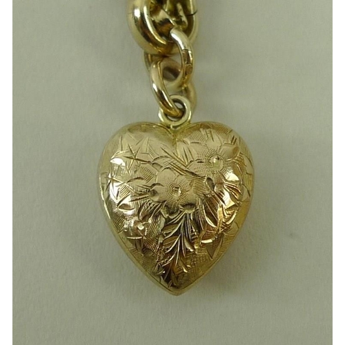 838 - A 9ct gold chain with heart shaped pendant, 74cm, 33.2g total weight.