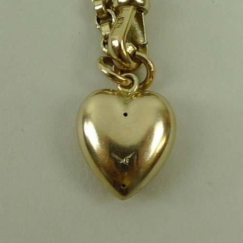 838 - A 9ct gold chain with heart shaped pendant, 74cm, 33.2g total weight.