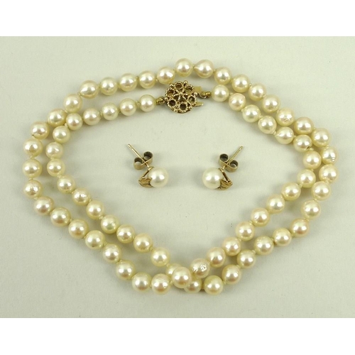 841 - A Mikimoto cultured pearl necklace, 46cm, and a pair of matching earring studs with leaf adornment, ... 