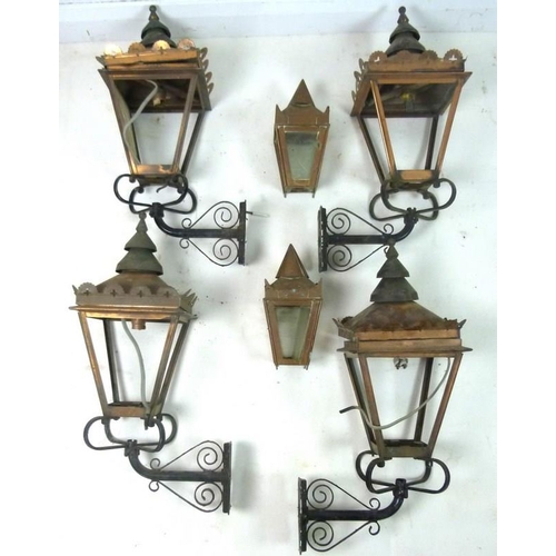 852 - Four copper lanterns with wall hanging brackets, 30 by 21 by 55cm high. (4)