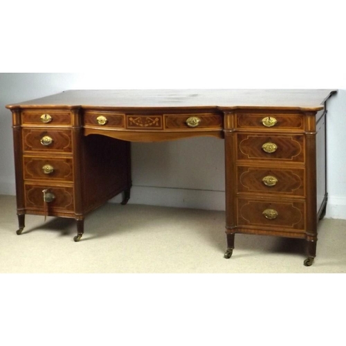 910 - An Edwardian mahogany bow fronted desk, attributed to Gillows, Lancaster, previously a dressing tabl... 