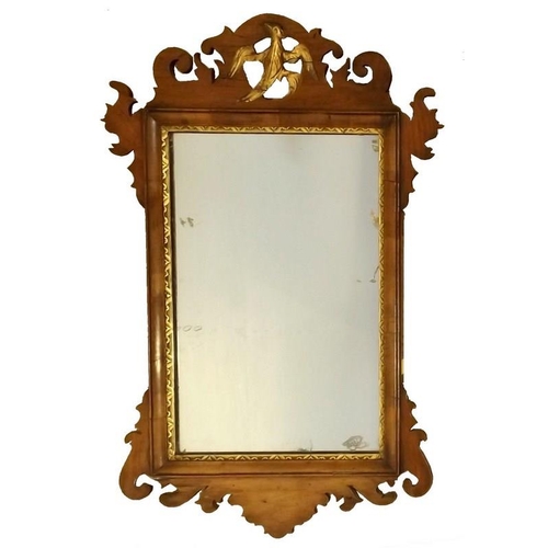 911A - A Georgian mahogany fretwork wall mirror, with gilt ho ho bird surmount, rectangular plate and gilt ... 