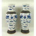 A pair of Chinese blue and white stoneware vases, each decorated with dragon chasing the flaming pea... 