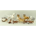 A collection of ceramic animal figurines comprising Beswick figures of three standing foxes, a seate... 