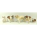 A group of bull dog figures comprising a Beswick seated bull dog, two Beswick Basford British Mascot... 