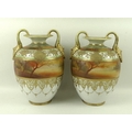 A pair of Noritake twin handled vases, 20th century, of ovoid form, decorated with sunset lake scene... 