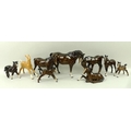 A group of Beswick horses, comprising a bay mare and foal, three further bay foals, a bay colt and a... 