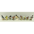 A group of eight Beswick birds, comprising Stonechat, number 2274, Whitethroat, number 2106, Chaffin... 