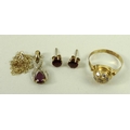 A group of jewellery comprising a 9ct gold diamond and ruby pendant, with a 9ct gold chain, a pair o... 
