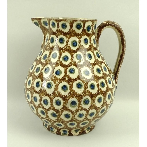 502 - A Staffordshire earthenware jug, circa 1780, in cream ground with dappled brown pattern and blue and... 