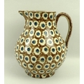 A Staffordshire earthenware jug, circa 1780, in cream ground with dappled brown pattern and blue and... 