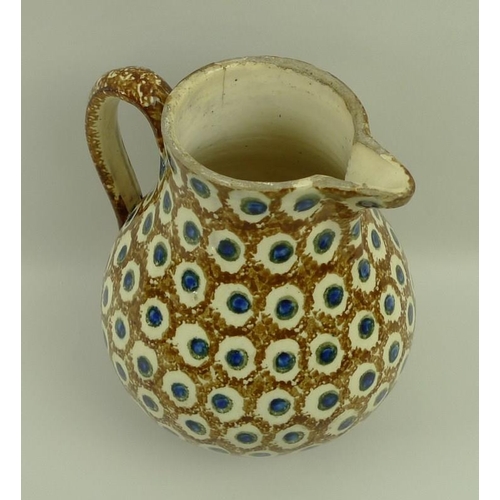 502 - A Staffordshire earthenware jug, circa 1780, in cream ground with dappled brown pattern and blue and... 