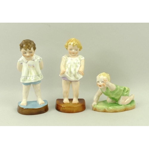 506 - A group of three Royal Worcester figurines comprising 'Tommy', 'Joan' and 'Michael', each modelled b... 
