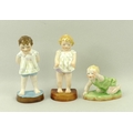 A group of three Royal Worcester figurines comprising 'Tommy', 'Joan' and 'Michael', each modelled b... 