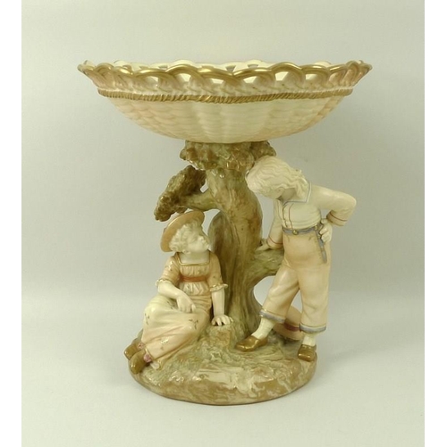 508A - A Royal Worcester blush ivory porcelain centre piece, circa 1891, the basket weave top, above natura... 