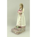 A Royal Worcester figurine 'The Bridesmaid', modelled by F G Doughty, shape number 3224, puce printe... 