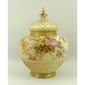 A Royal Worcester blush ivory porcelain pot pourri, painted with flowers, gilded highlights througho... 
