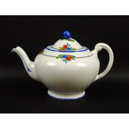 521 - A Tuscan China part tea service, decorated with brightly coloured berries, flowers and fruit with bl... 