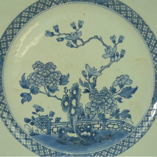 522 - A Chinese ceramic hexagonal dish, 18th century, in blue and white and decorated with peonies, 36cm h... 