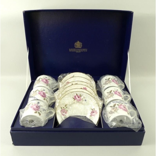 525A - A Royal Worcester coffee set, in the 'Marissa' pattern, comprising six coffee cans and saucers, boxe... 