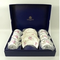 A Royal Worcester coffee set, in the 'Marissa' pattern, comprising six coffee cans and saucers, boxe... 