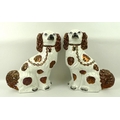 A pair of Staffordshire flatbacks of King Charles spaniels, in copper lustre, 32cm.