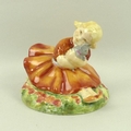 A Royal Worcester figurine 'Marigold', modelled by Anne Acheson, circa 1935, No. 2930, puce printed ... 