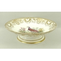 A Coalport tazza, circa 1845, with gilt shell border and central ornithological hand painted exotic ... 