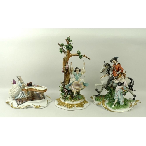 539A - A group of three Capodimonte figurines, mid 20th century, comprising a girl on a swing, 28cm, a chev... 