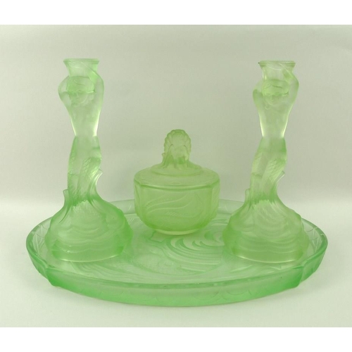 540 - An Art Deco green etched glass dressing table set, comprising an oval tray, 35 by 26cm, lidded pot, ... 