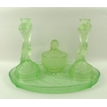 An Art Deco green etched glass dressing table set, comprising an oval tray, 35 by 26cm, lidded pot, ... 