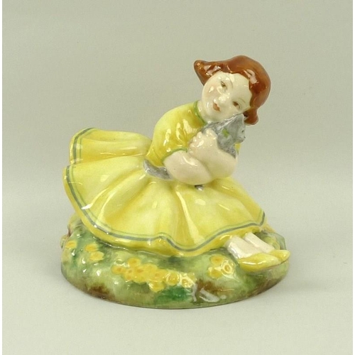 543A - A Royal Worcester figurine 'Buttercup', modelled by Anne Acheson, circa 1935, No. 2930, puce printed... 