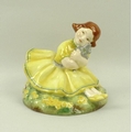 A Royal Worcester figurine 'Buttercup', modelled by Anne Acheson, circa 1935, No. 2930, puce printed... 