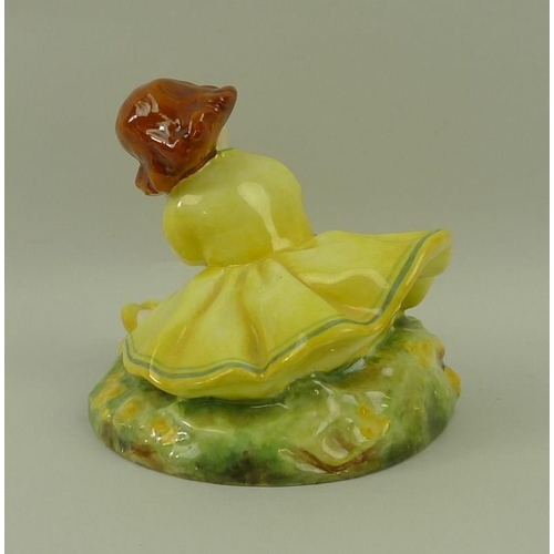 543A - A Royal Worcester figurine 'Buttercup', modelled by Anne Acheson, circa 1935, No. 2930, puce printed... 