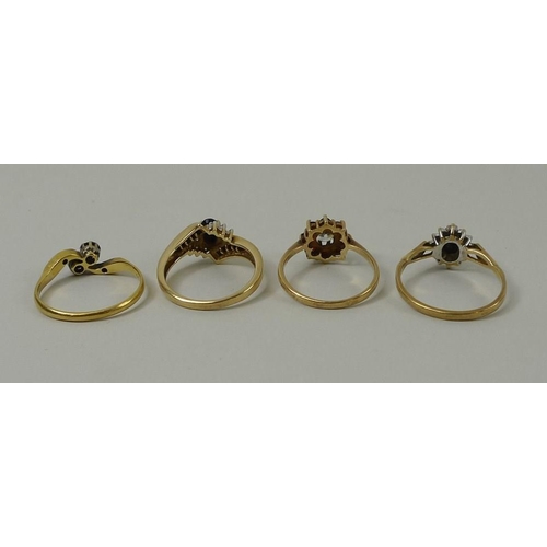 806 - An 18ct gold and diamond crossover ring, size O, 2.5g, an 18k gold ring, size N, and two 9ct gold ri... 