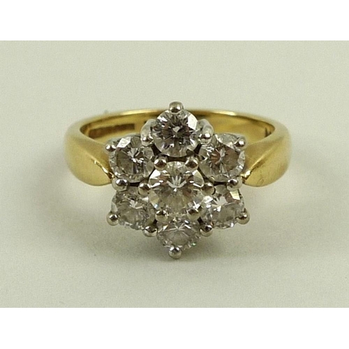 808 - An 18ct gold and diamond cluster ring, the seven diamonds totalling 1.5ct, with 1.50 marked to insid... 