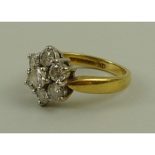 808 - An 18ct gold and diamond cluster ring, the seven diamonds totalling 1.5ct, with 1.50 marked to insid... 