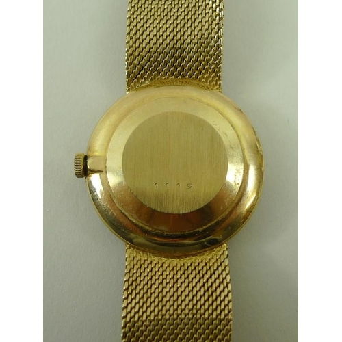 813 - A gentleman's Rotary 9ct golf wristwatch, the circular face with baton numerals, with textured gold ... 