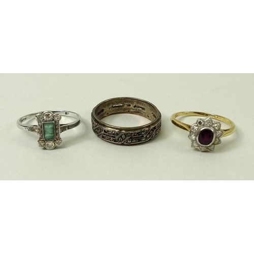 815 - A 1930s platinum, diamond and emerald ring, size R, a diamond and ruby ring, size Q, and an eternity... 