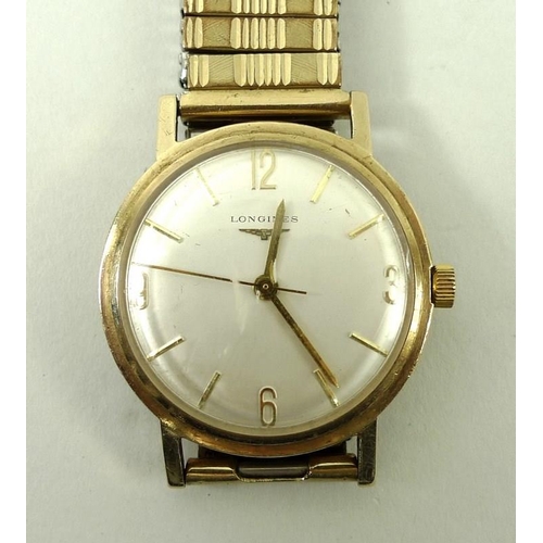 816 - A Longines 1950s gentleman's wristwatch, the silvered face with baton numerals, and Arabic numerals ... 