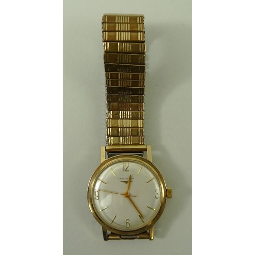 816 - A Longines 1950s gentleman's wristwatch, the silvered face with baton numerals, and Arabic numerals ... 